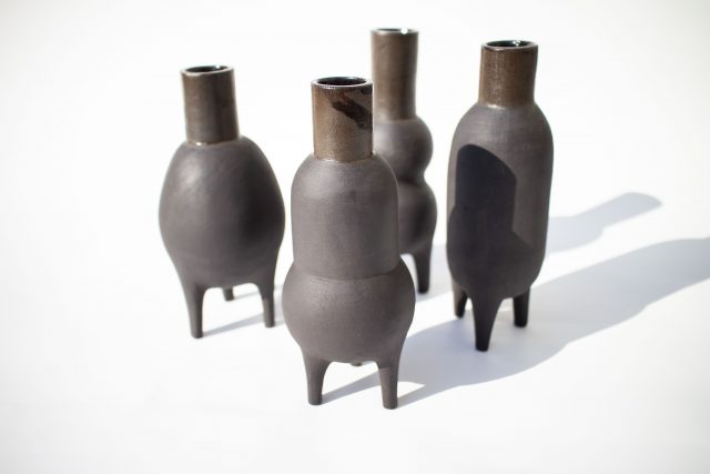black clay ceramic vase pot legs