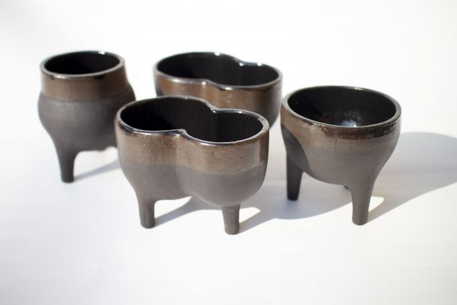black clay ceramic vase pot legs
