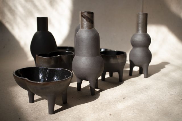 black clay ceramic vase pot legs