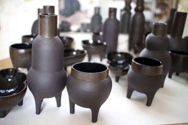 black clay ceramic vase pot legs