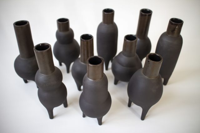 black clay ceramic vase pot legs