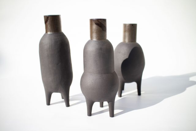 black clay ceramic vase pot legs